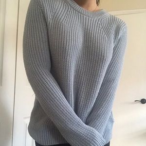 Knitted sweater.